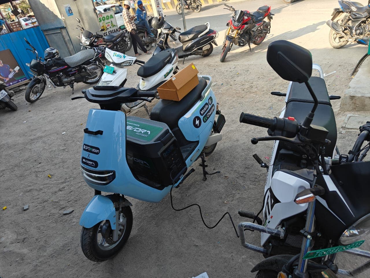 EVORA mobile charging unit charging another EV on street